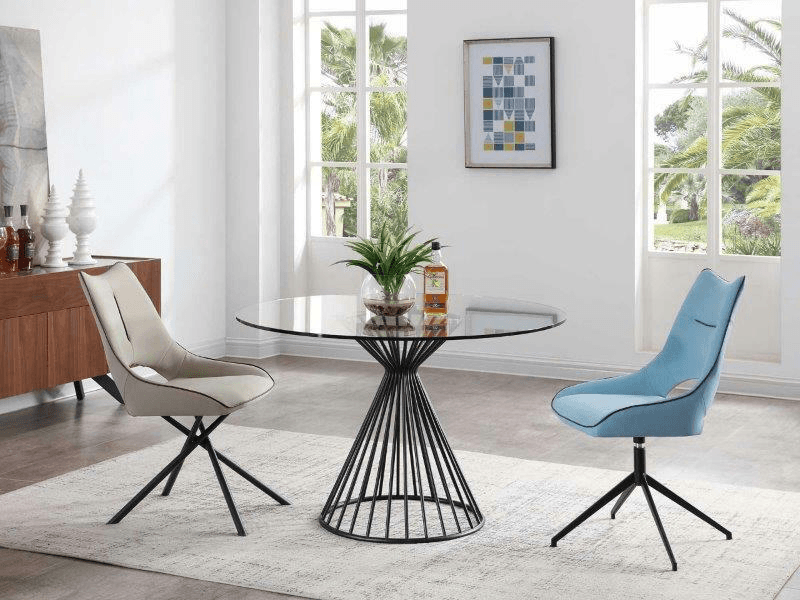 round, glass top dining table with a iron base plus two dining chairs